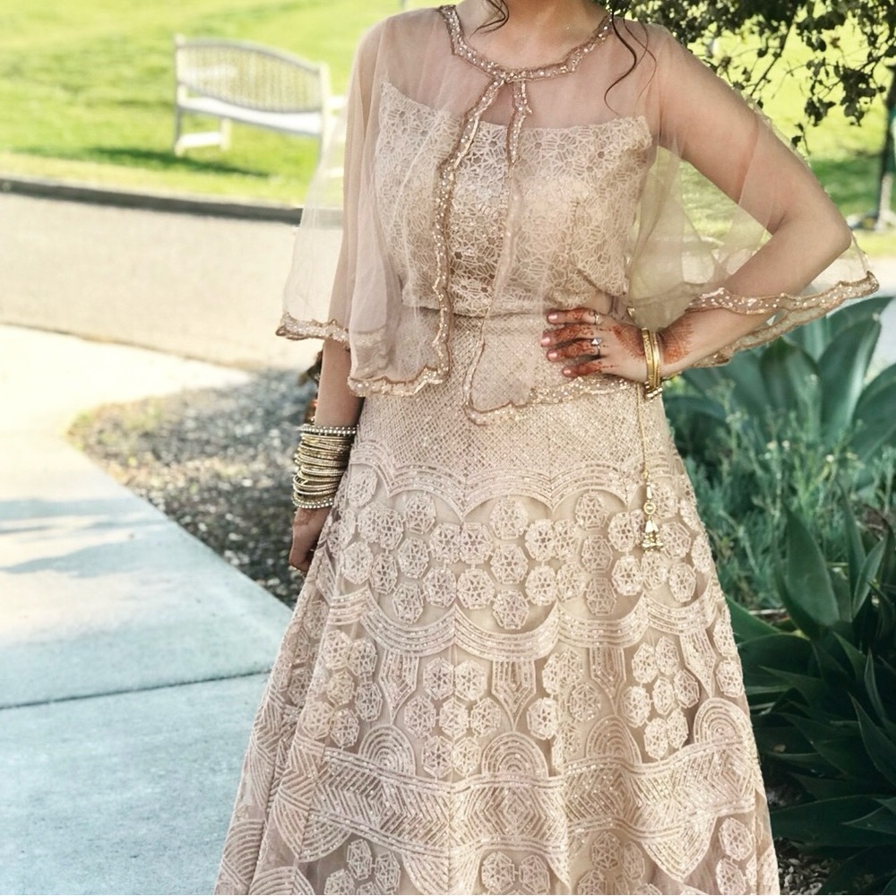 Golden Indian bridal/formal Lengha with sheer cape and heavy embroidery